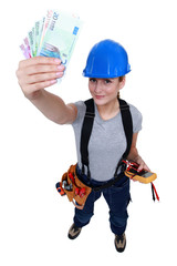 Electrician with a handful of cash