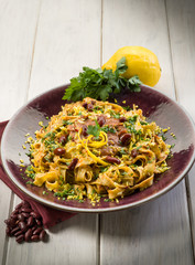 pasta with beans sauce grated lemon peel and parsley, vegetarian