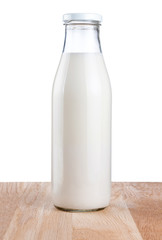 Bottle of fresh milk is wooden table Isolated on white backgroun