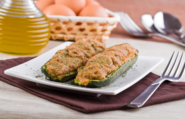 Stuffed zucchini halves.