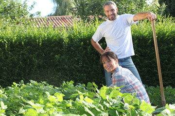 A nice couple gardening.