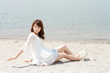 Fototapeta na wymiar Beautiful young woman on beach summer holiday. Portrait of asian