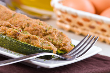 Stuffed zucchini halves.