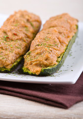 Stuffed zucchini halves.