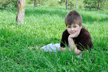 A boy in summer park