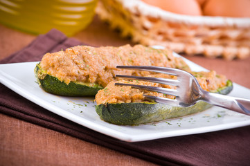Stuffed zucchini halves.