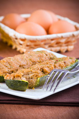 Stuffed zucchini halves.