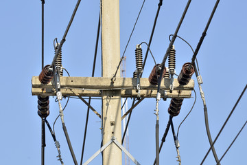 electricity post in blue sky