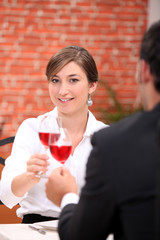 Couple toasting with rose wine