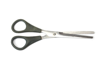 Jagged edges hairdressing scissors. Isolated over white