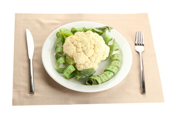 Fresh cauliflower and measuring tape