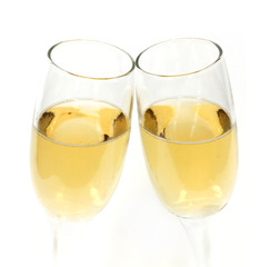 Pair of champagne glasses making a toast