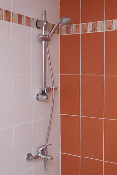 Red bathroom interior. Tap and shawer.