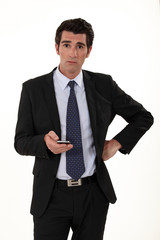 Businessman surprised by text message