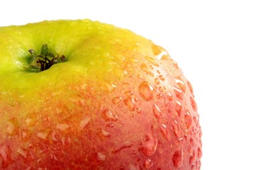 Fresh apple with water drops on  a white background