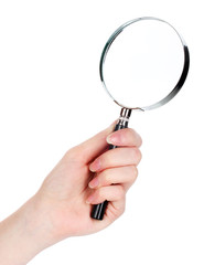 Magnifying glass in hand isolated on white