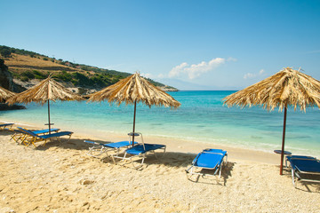 Beautiful beach view with sunbeds and umbrellas at Xigia beach.