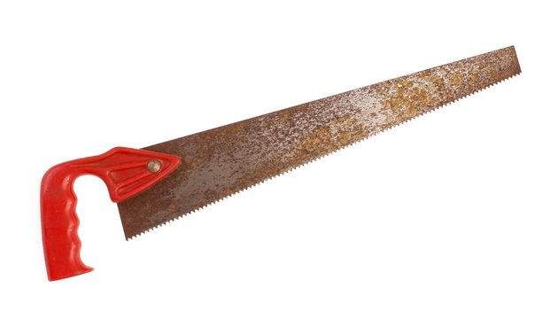 Old rusty crosscut handsaw on white background