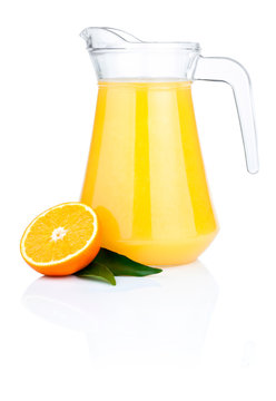 Orange juice in pitcher, half oranges and the leaves, Isolated o