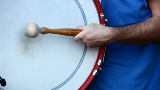 Drummer Playing A Bass Drum in a concert