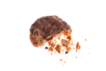 Chocolate cookie with crumbs and missing bite