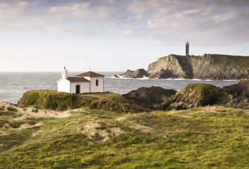 Coastal landscape with chapel and lighthouse