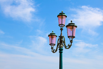 Fototapeta na wymiar old street-lamp on blue sky