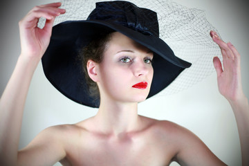 Portrait of a cute girl in a hat