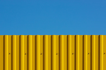 Yellow decking and blue sky