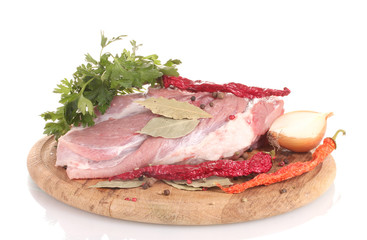 Raw meat and vegetables on a wooden board isolated on whitе