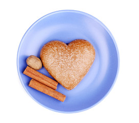 Heart-shaped cookie with cinnamon and nutmeg