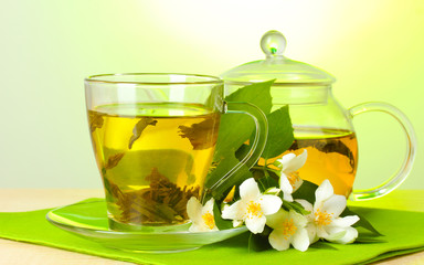 green tea with jasmine in cup and teapot