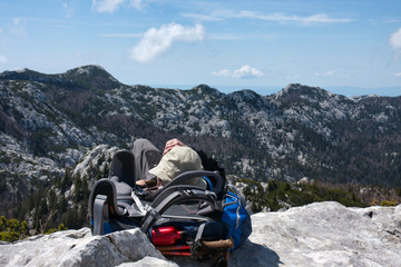 Fototapeta premium mountaineer resting on the top of the hill