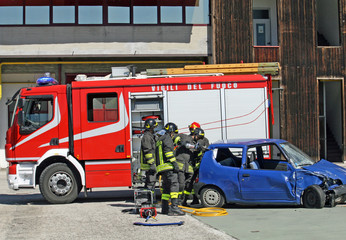 car destroyed in a traffic accident and firefighter
