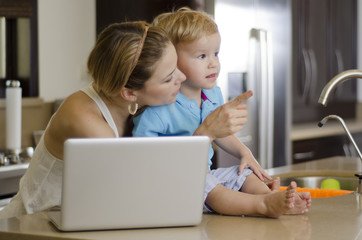 Mom showing something to her son