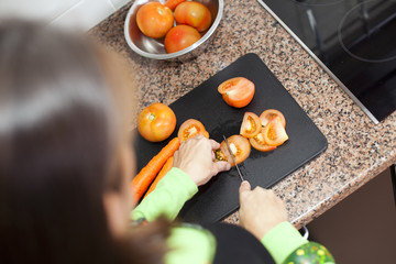 Woman preparing food at the kitchen