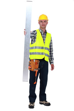 Tradesman holding up a steel girder
