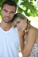 Fototapeta premium Blond woman leaning on man's shoulder