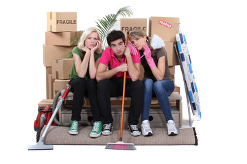 Unhappy housemates cleaning their flat before moving out