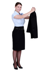 Fototapeta premium A businesswoman taking off her jacket.