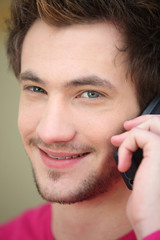 Close-up of man using his mobile telephone