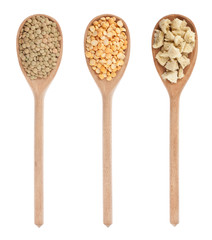 lentils, peas, soy  in three wooden spoons