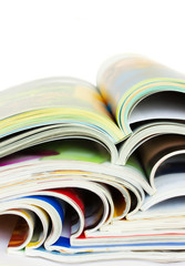 heap of open magazines