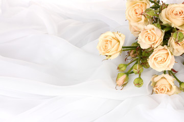 Small roses in a white cloth isolated on white