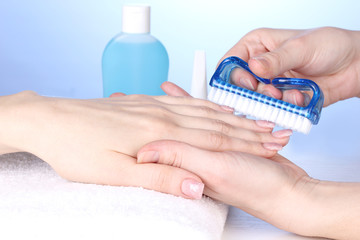 Manicure process in salon
