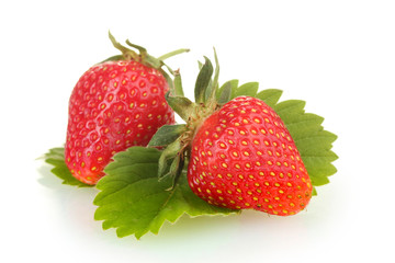 sweet ripe strawberries with leaves isolated on white