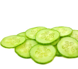 Fototapeta na wymiar slices of cucumber arranged on white