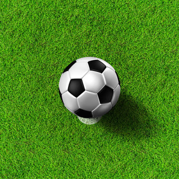 Football ( soccer  ball ) in grass field.