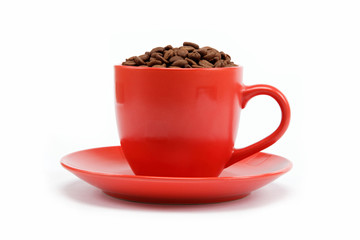 cup with beans coffee on saucer