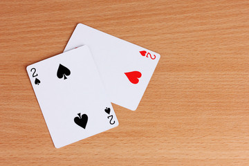 Two cards on wooden background